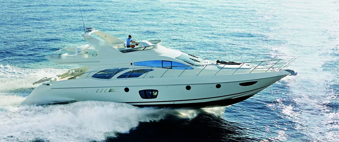 Fiberglass motor yacht underway offshore
